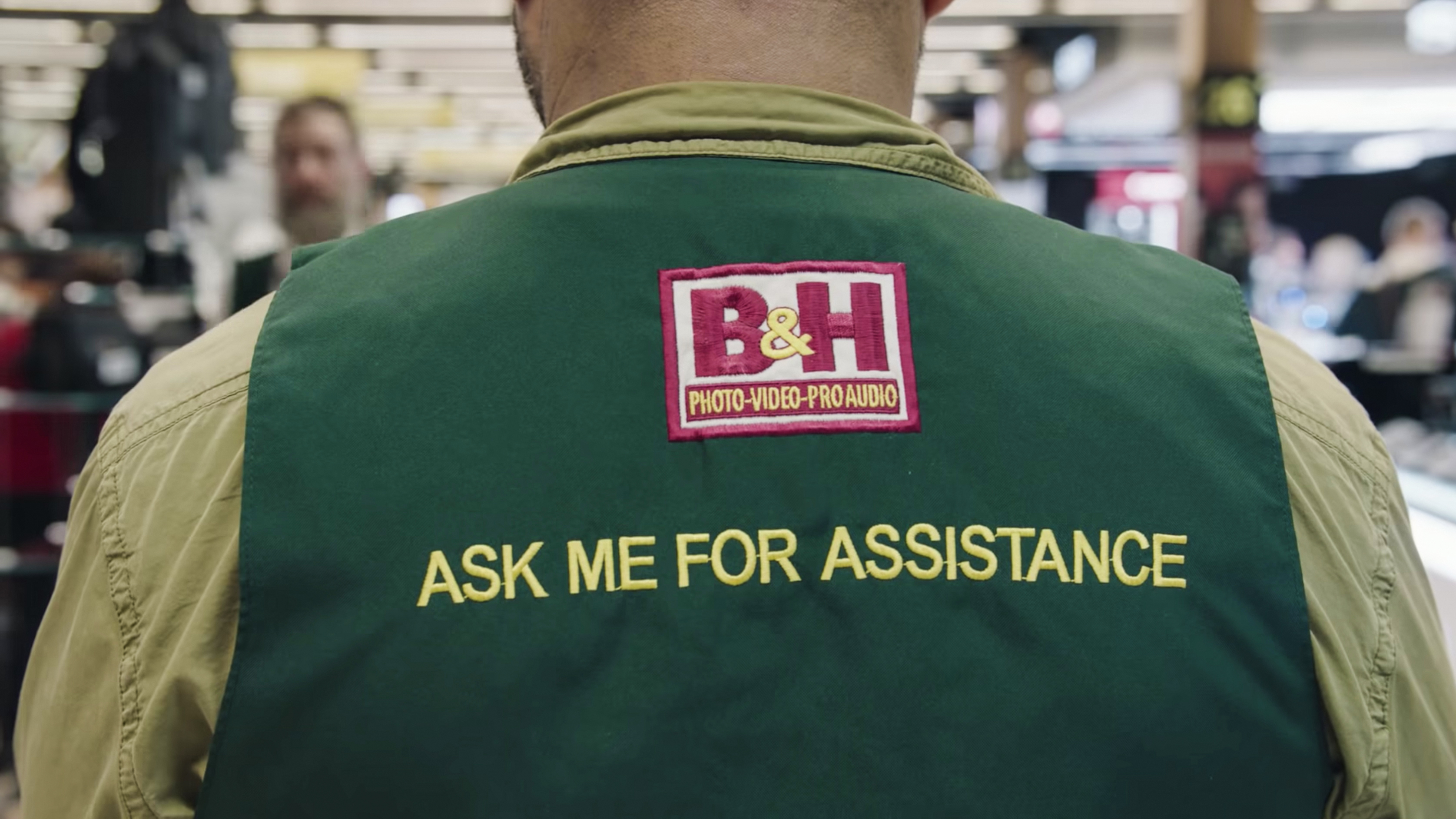 Close-up of the back of a B&H staff member, with the words 