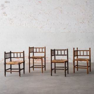 Four engraved wooden corner dining chairs from Magnolia