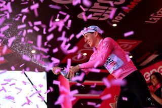 Tadej Pogačar celebrates keeping pink after stage 14 of the Giro d'Italia 2024