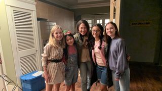 the baby sitters club l to r shay rudolph as stacey mcgill, momona tamada as claudia kishi, showrunner rachel shukert, malia baker as mary anne spier and sophie grace as kristy thomas in the baby sitters club cr courtesy of netflixnetflix © 2020