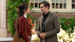 Charly Clive looking at Phil Dunster in Rooster.