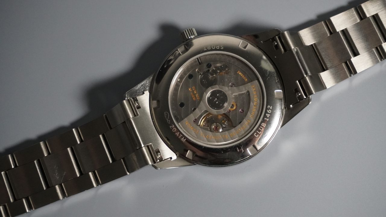 The Nomos Club Sport Neomatik on a grey and black background