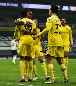 Fulham players gather to celebrate their equaliser against Tottenham on Wednesday, despite Premier League guidance to avoid doing so