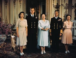 Princess Elizabeth, Lieutenant Phillip Mountbatten, her then fiance, her mother, then Queen Elizabeth, now the Queen Mother, and her father, King George VI, in a family photograph