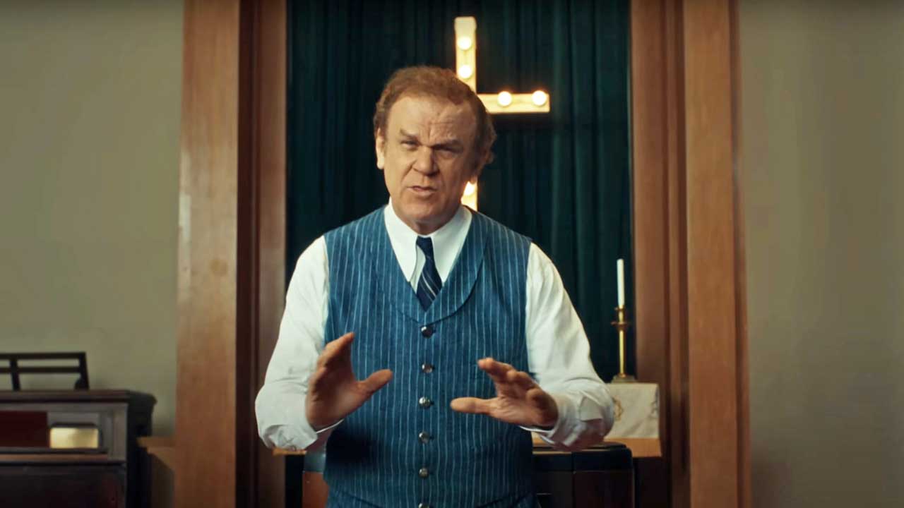 John C. Reilly in the video for Archbishop Harold Holmes 