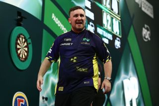 LONDON, ENGLAND - JANUARY 02: Luke Littler of England reacts during his Semi-Final match against Stephen Bunting of England during day fifteen of the 2024/25 Paddy Power World Darts Championship at Alexandra Palace on January 02, 2025 in London, England. (Photo by James Fearn/Getty Images)