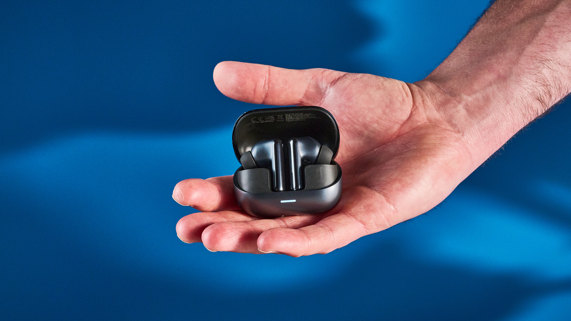 A pair of black Honor Earbuds 4 wireless earbuds