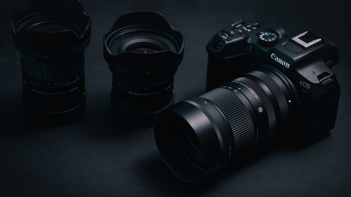 Sigma 50-120mm F2.8 DC OS Contemporary lens attached to a Canon EOS R7, in a lowkey lit studio with dark background