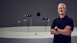 Apple CEO Tim Cook stands in front of several Vision Pro headsets.