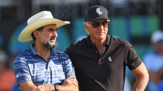 Yasir Al-Rumayyan talking to Greg Norman