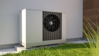 Heat pump on grass lawn as part of home eco heating systems