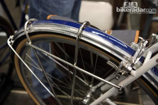 Traditional fender stays are eliminated in favor of a dual-purpose lowrider rack on this Steve Rex bike. Check out the polished fenders with the painted center stripe, too.