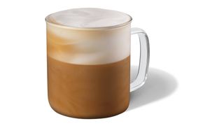 Glass mug containing Starbucks Cappuccino