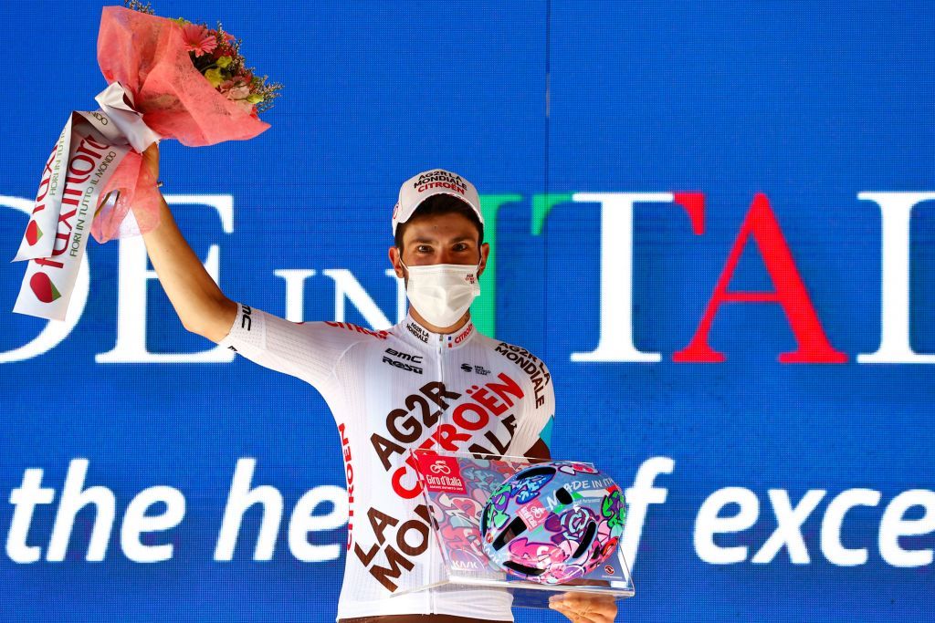 Team AG2R rider Italys Andrea Vendrame celebrates on the podium after winning the twelfth stage of the Giro dItalia 2021 cycling race 212 km between Siena and Bagno di Romagna on May 20 2021 Photo by Luca Bettini AFP Photo by LUCA BETTINIAFP via Getty Images