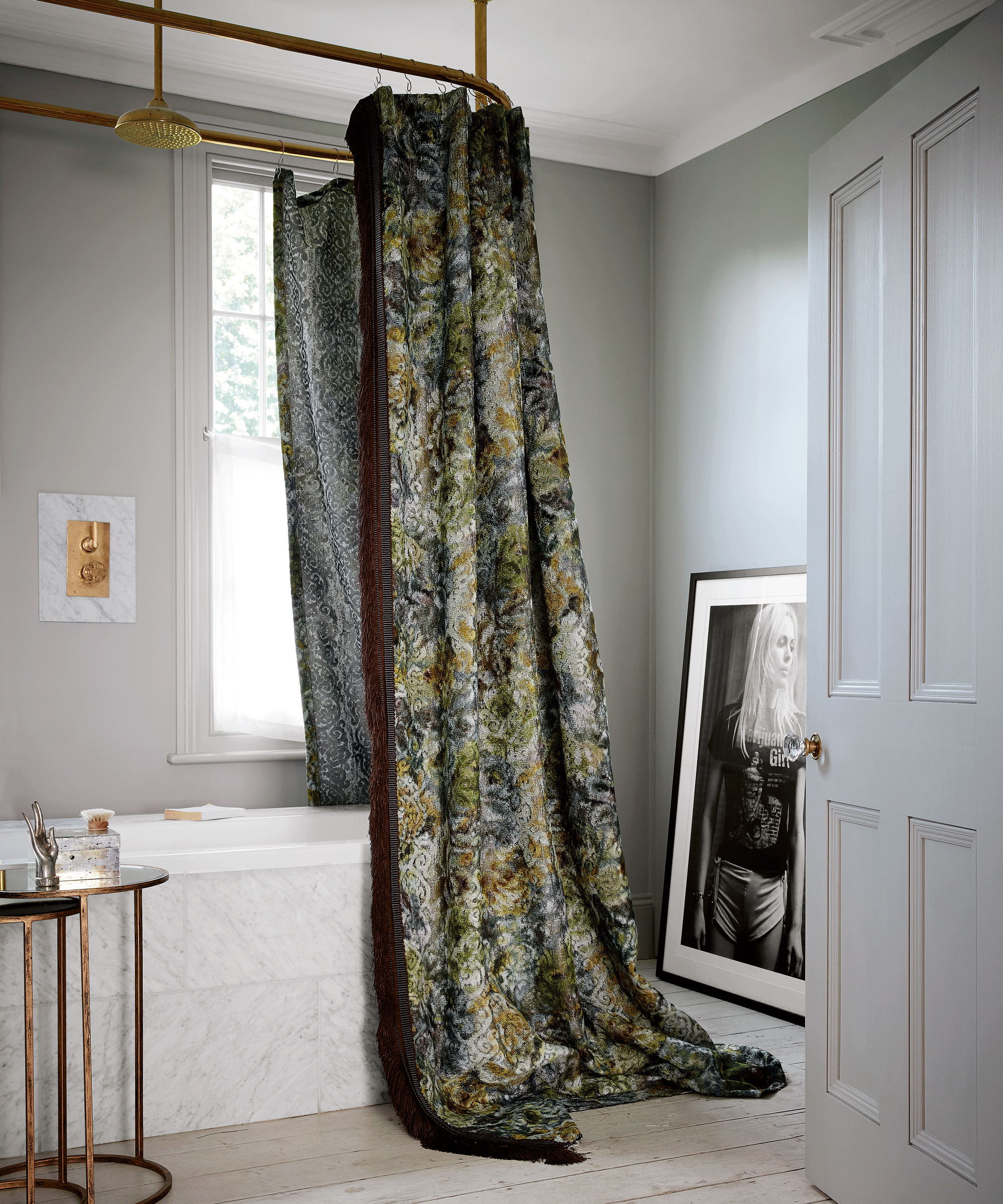 Patterned shower curtain that pools to the floor over a bath