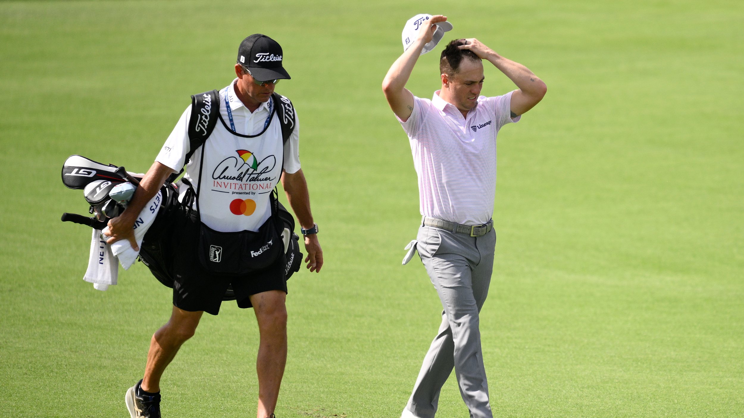 Justin Thomas and his caddie during the Arnold Palmer Invitational