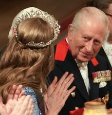 Princess Kate wearing a tiara and blue evening gown