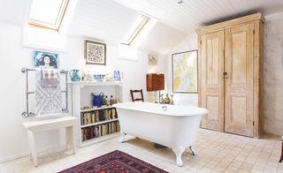 New bathroom converted from a former sheep byre with velux rooflights in a coastal home