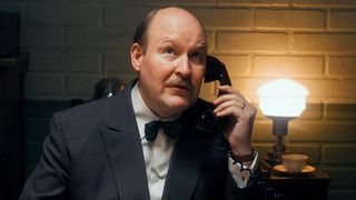 Henrik Dorsin as G&ouml;sta Engzell in The Swedish Connection, holding a telephone.