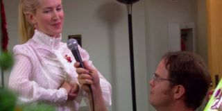 Dwight aiding Angela in singing in The Office.