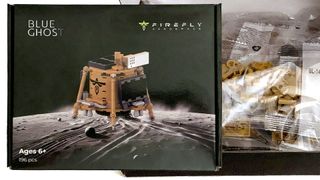 The box and interior of a moon lander building block set