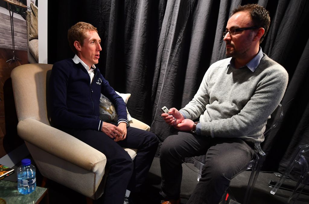 Dan Martin answering questions from the press