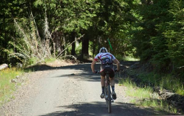 A Team Jamis rider races through the Andes