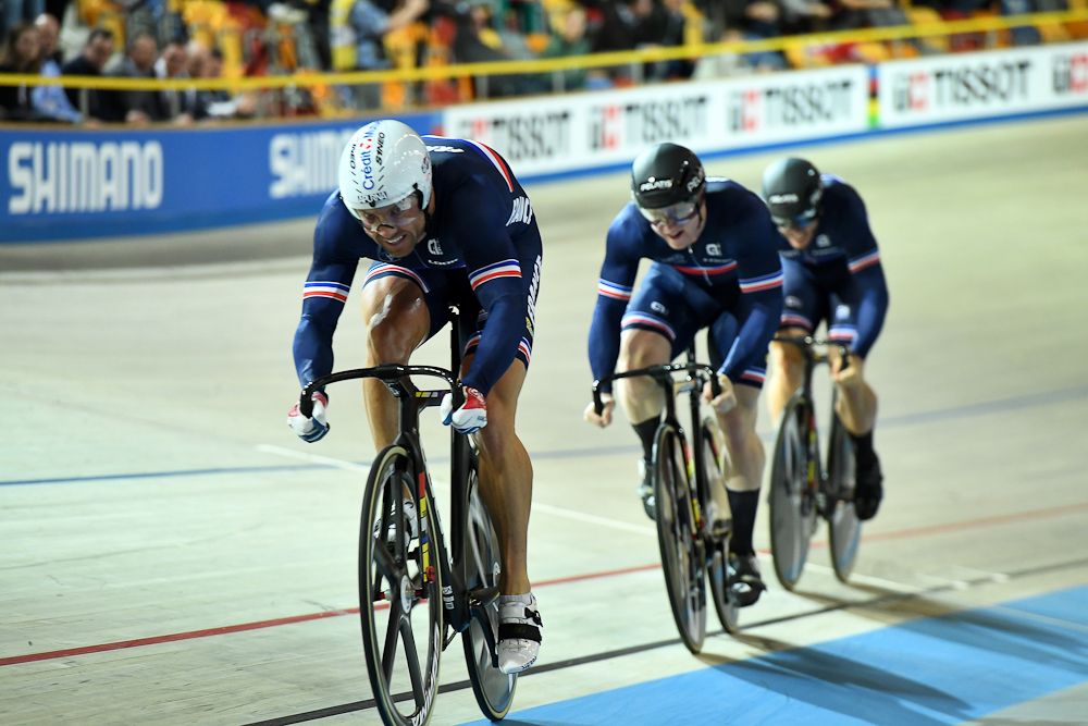 France's Francois Pervis (L) leads teammates Sebastien Vigier (C) and Quentin Lafargue (R) during the men's team sprint bronze final race against Russia