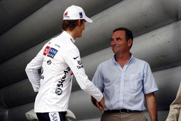 Best young rider Andy Schleck is greeted by five-time Tour winner Bernhard Hinault.