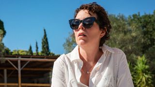 Olivia Colman sitting on a sunlounger
