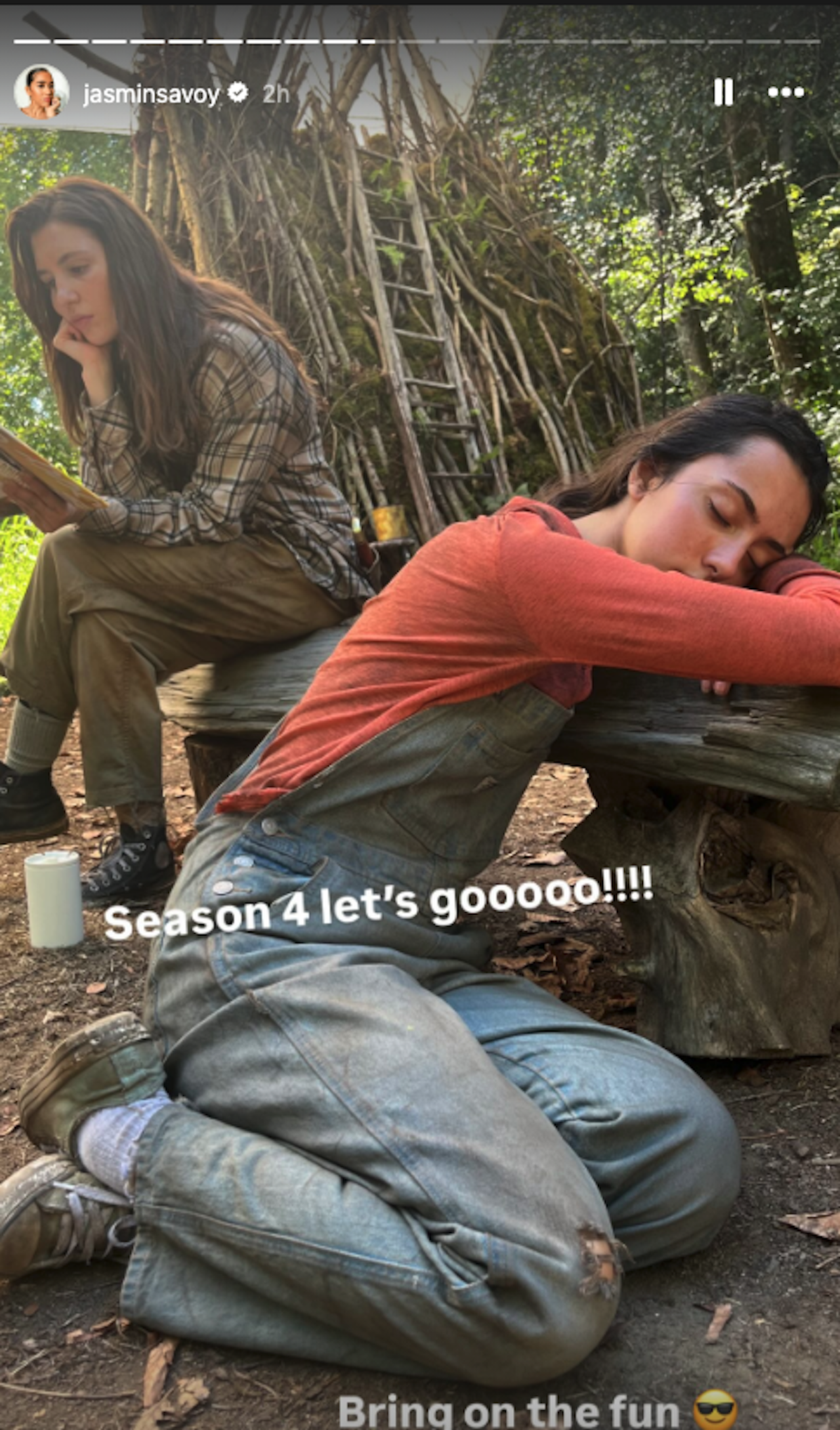 Jasmin Savoy-Brown photo from on set of Yellowjackets of one cast member reading and another napping as Season 4 is renewed