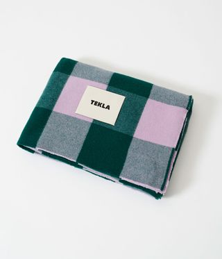 Tekla picnic blanket folded up in green and purple