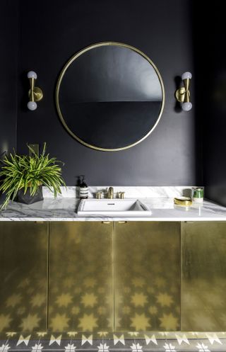 Bathroom vanity ideas with a gold vanity unit matching a gold mirror