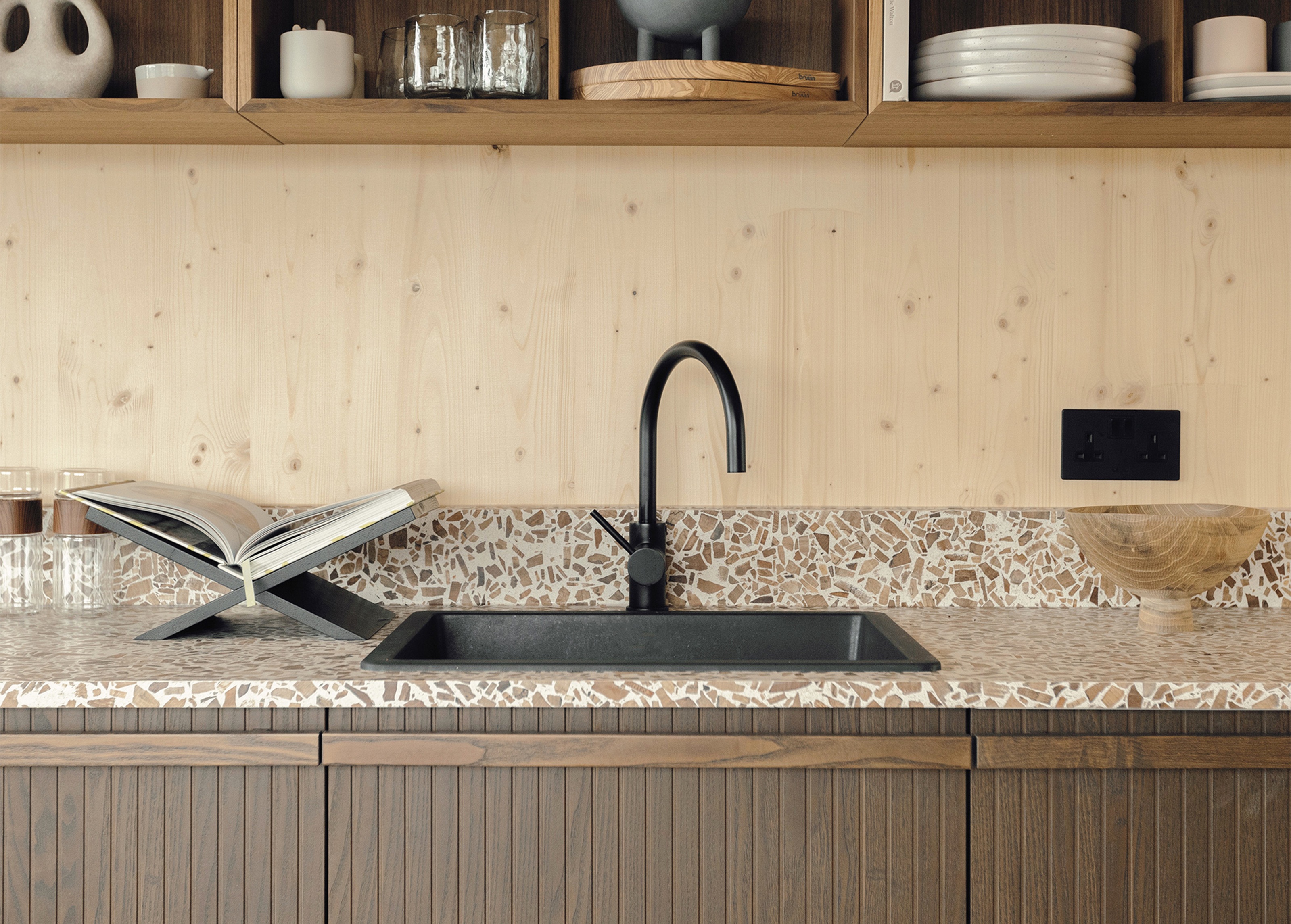 an all wood kitchen with a worktop made from a wood-based terrazzo