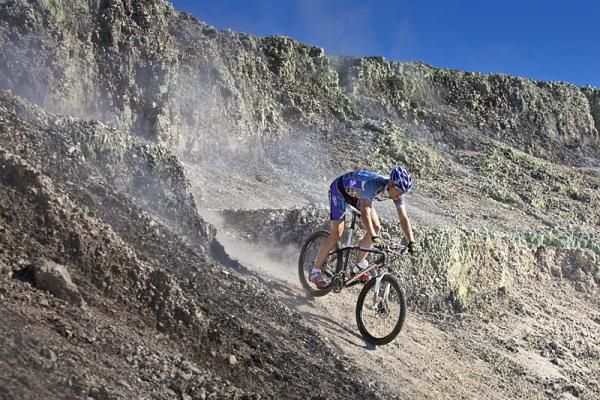 A Trek Brentjens Mountain Bike Team rider descends.