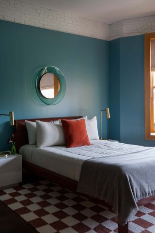 A bedroom with blue walls