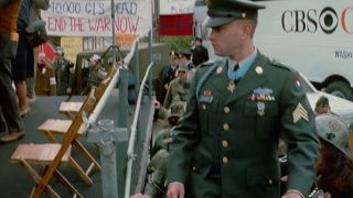 Tom Hanks in full military garb walking up some stairs in Forrest Gump