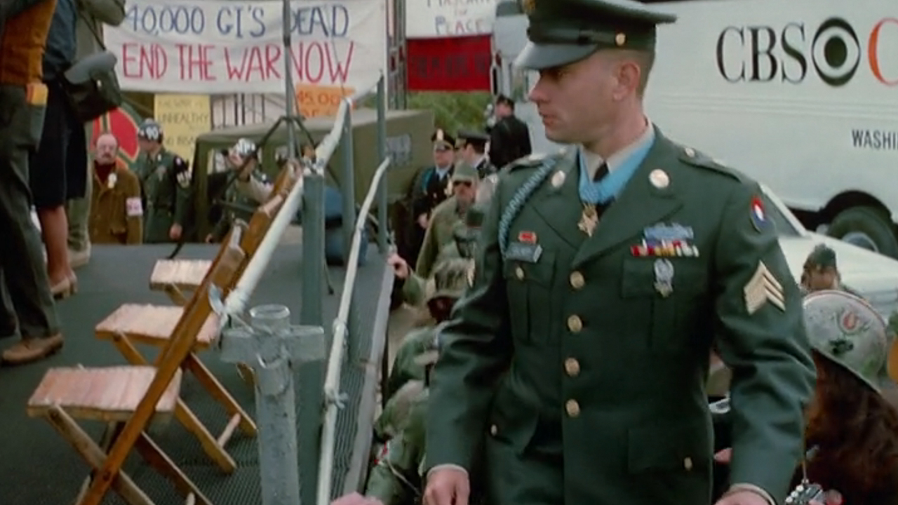 Tom Hanks in full military garb walking up some stairs in Forrest Gump