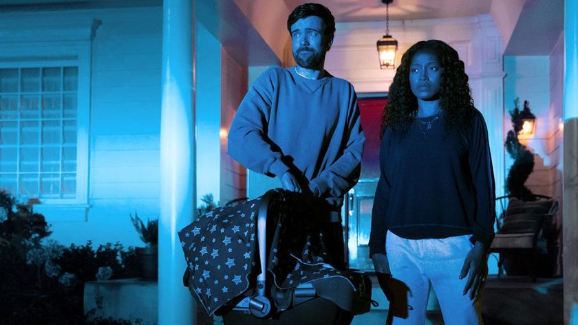 Samira and Rob standing in front of their house at night n The Burbs