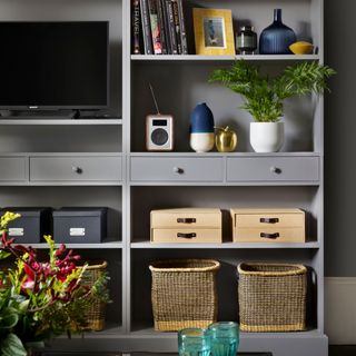 Grey media unit with open and closed storage