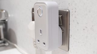 The side view of the Hive Active Smart Plug connected to an electrical outlet