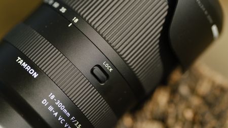 The Nikon mount version of the Tamron 18-300mm f/3.5-6.3 lens photographed outdoors