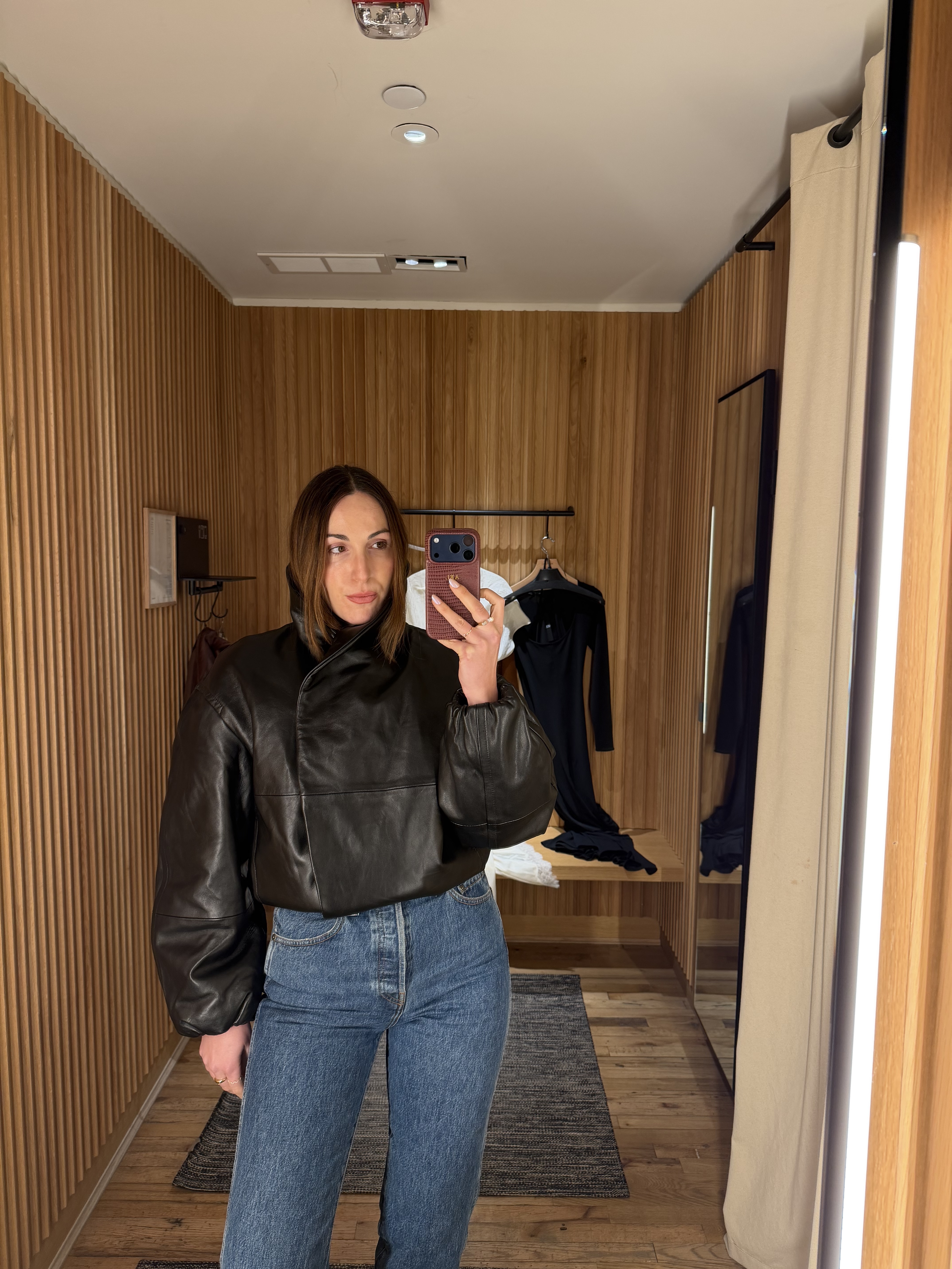senior fashion editor Anna LaPlaca wearing Mango Selection pieces inside a store dressing room