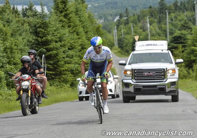 Svein Tuft (Orica GreenEDGE) catches and passes the Broom Wagon