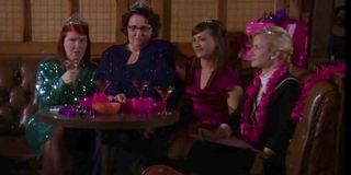 the four bachelorettes seated at a table in Threat Level Midnight