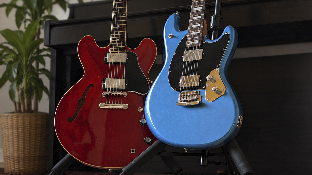 Gibson ES-335 and Music Man Stingray Baritone in front of a piano