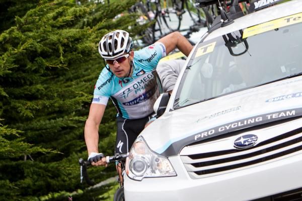 An Omega Pharma-Quickstep rider gets some help after going down.