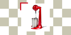 A red retro milkshake mixer on a checkerboard background