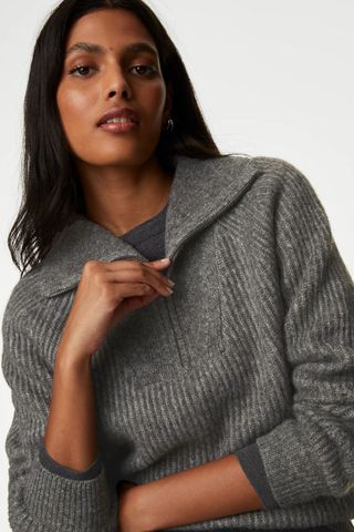 grey jumpers woman wearing 3 quarter zip dark grey knit