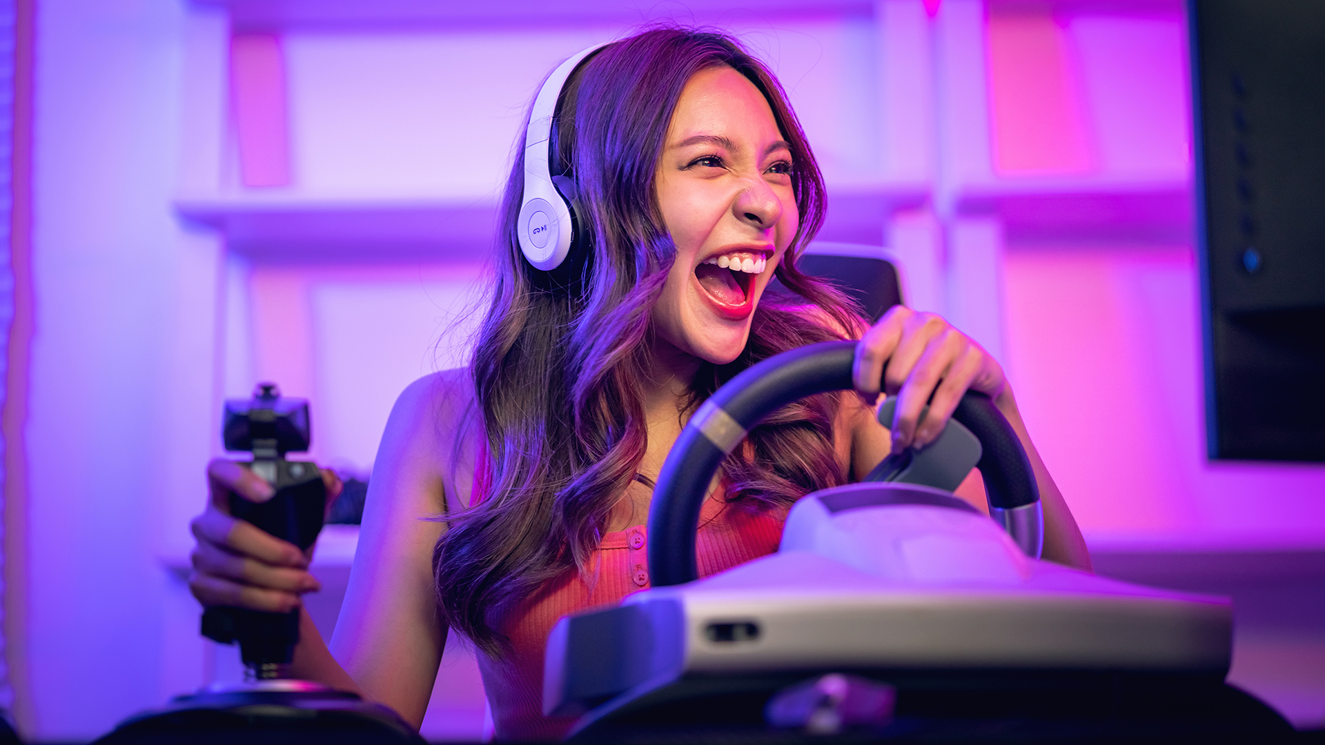 Gamer girl is playing thrilling driving games, technology ideas